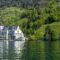 Explore the picturesque landscape of Vitznau by Lake Lucerne with its majestic architecture.